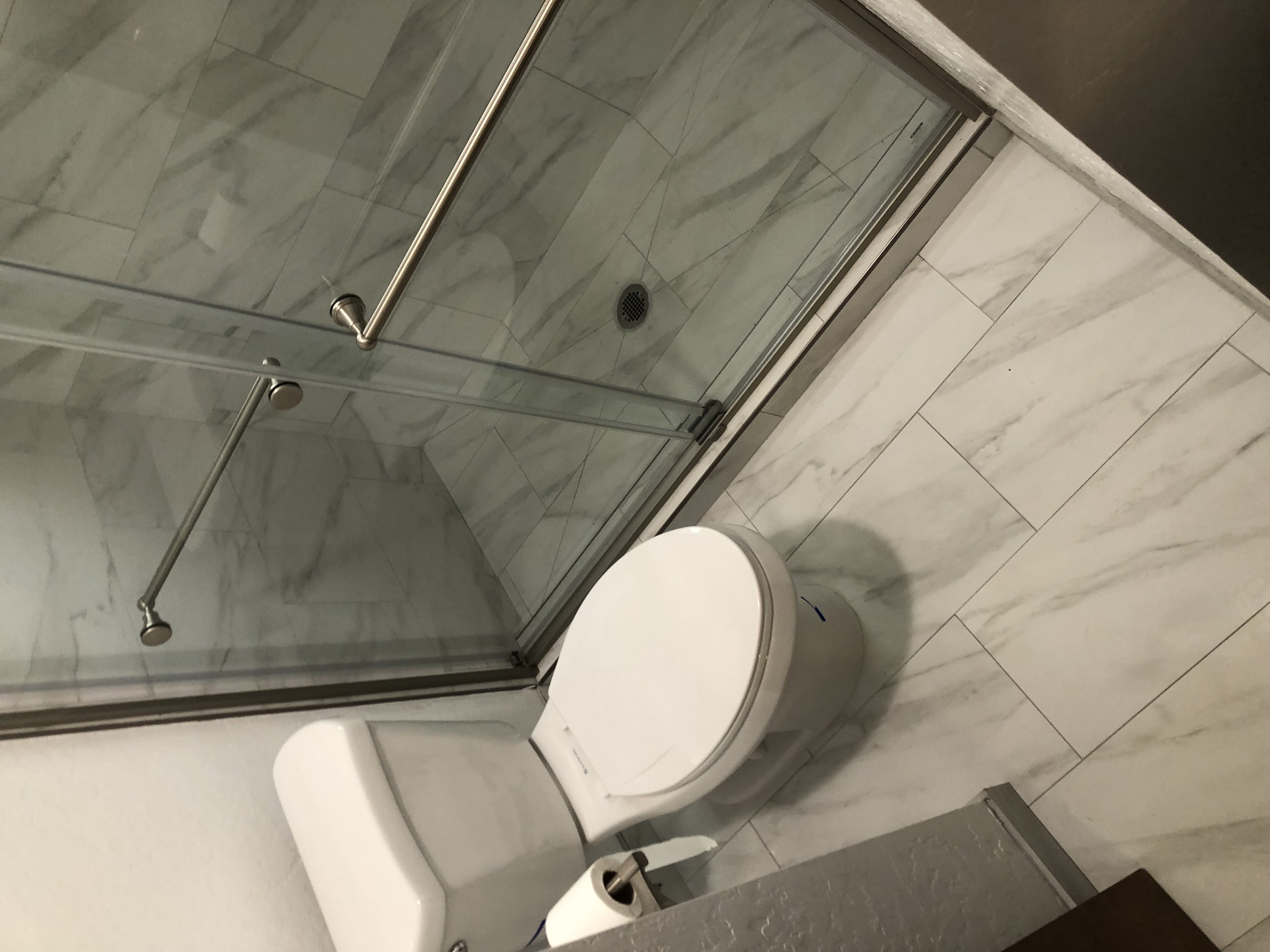 Complete bathroom with glass shower and toilet