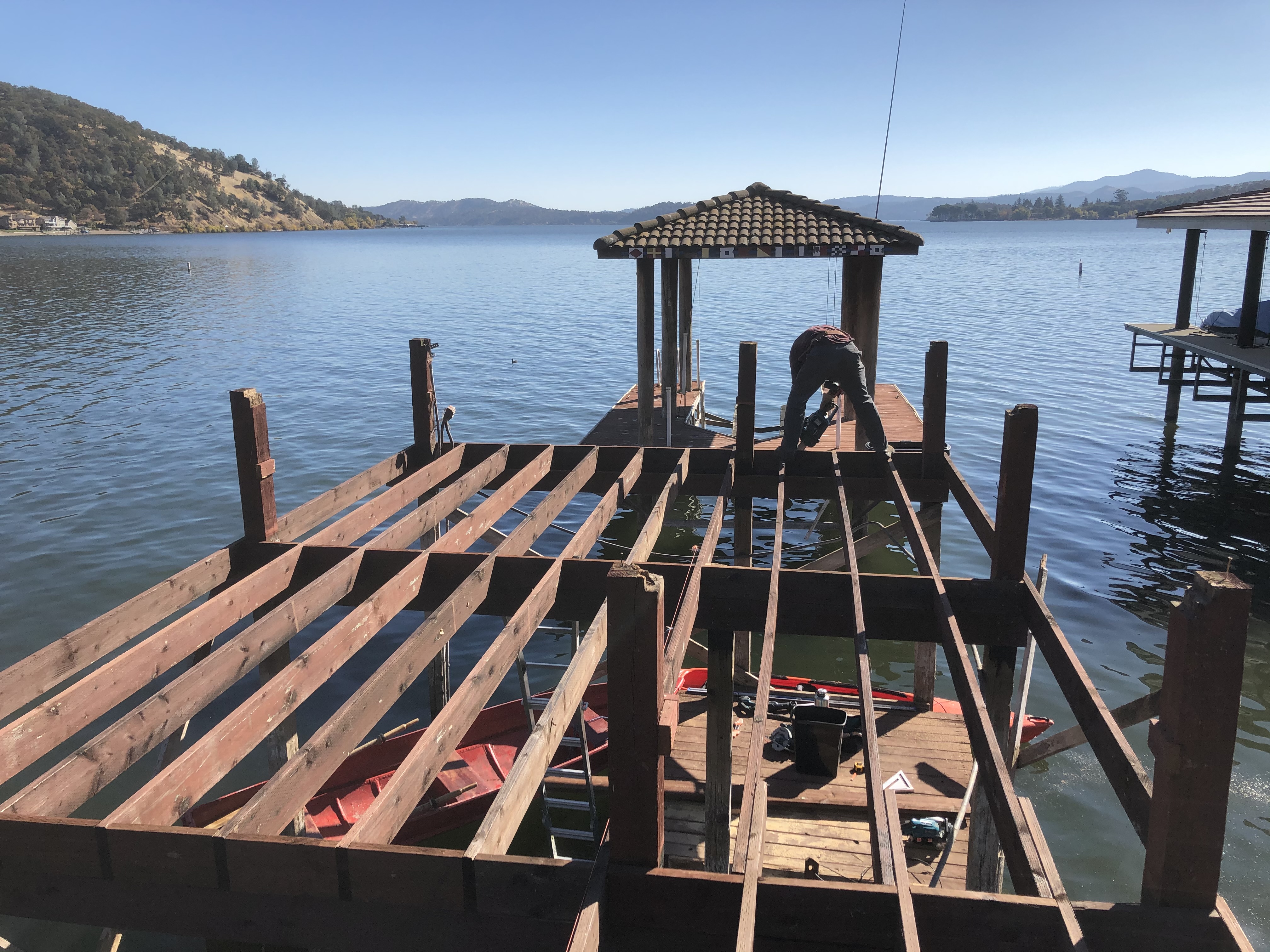 Dock framing with exposed joists over lake