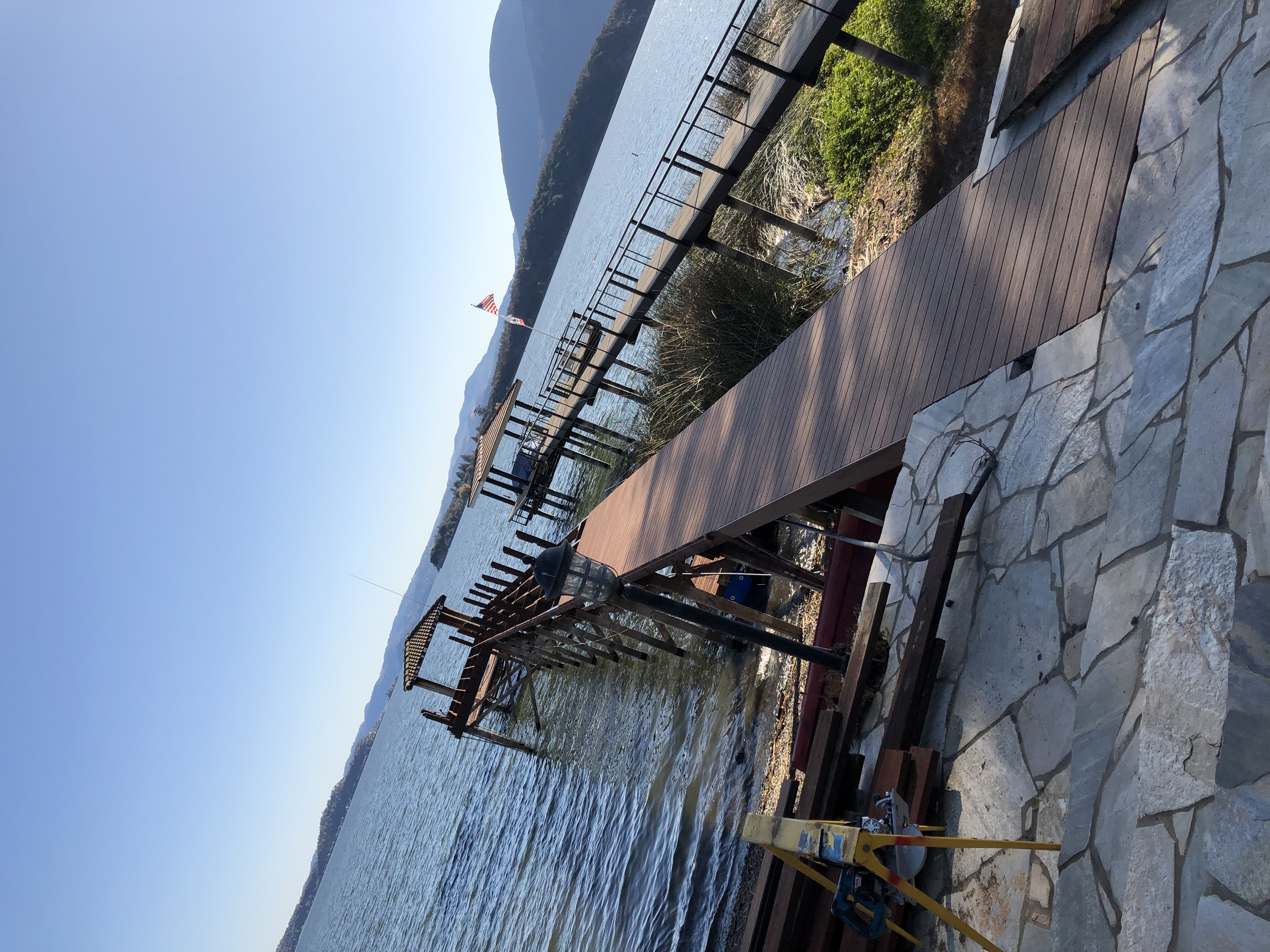 Lakefront dock construction with mountain views