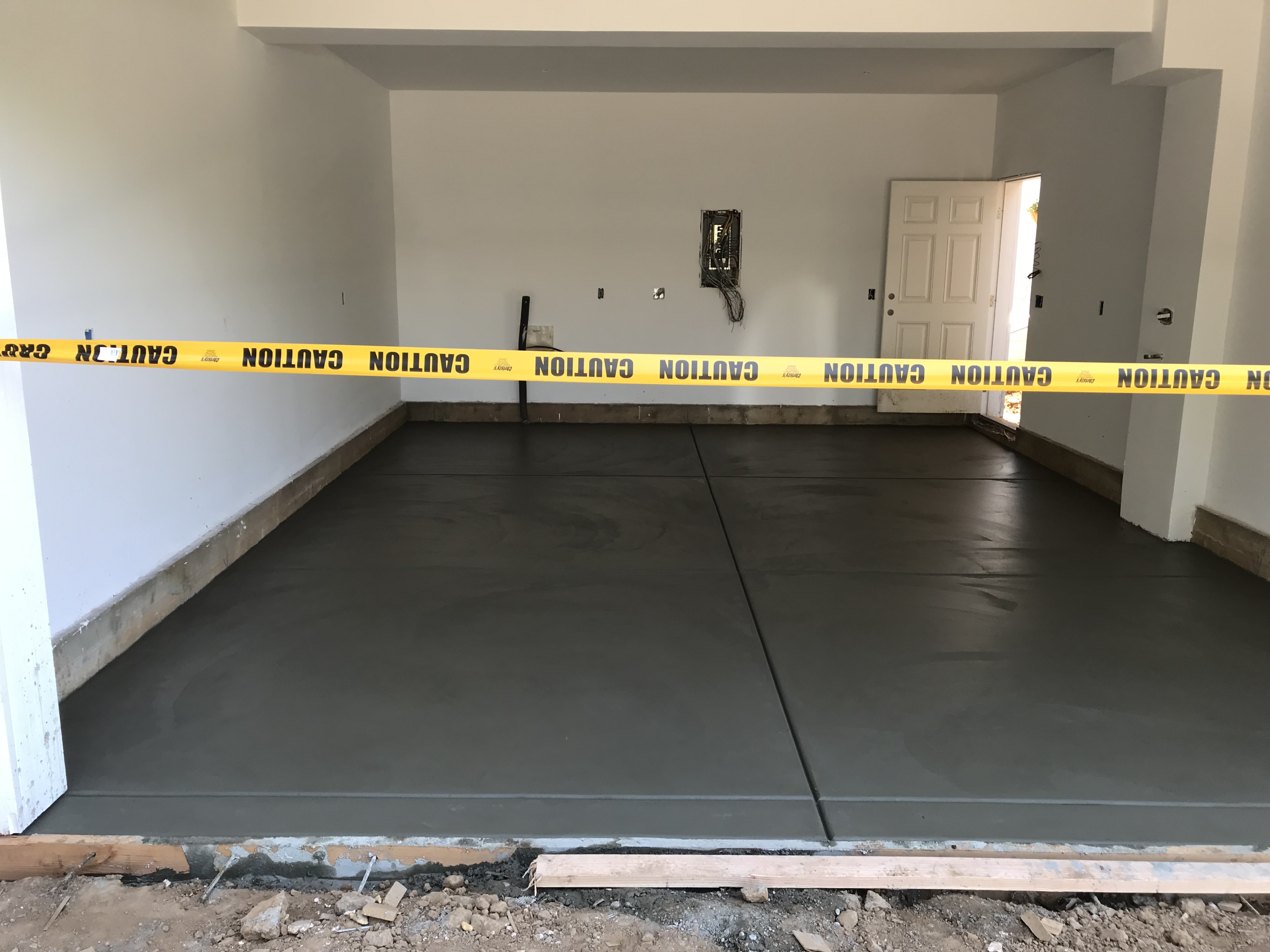 Fresh concrete garage floor pour