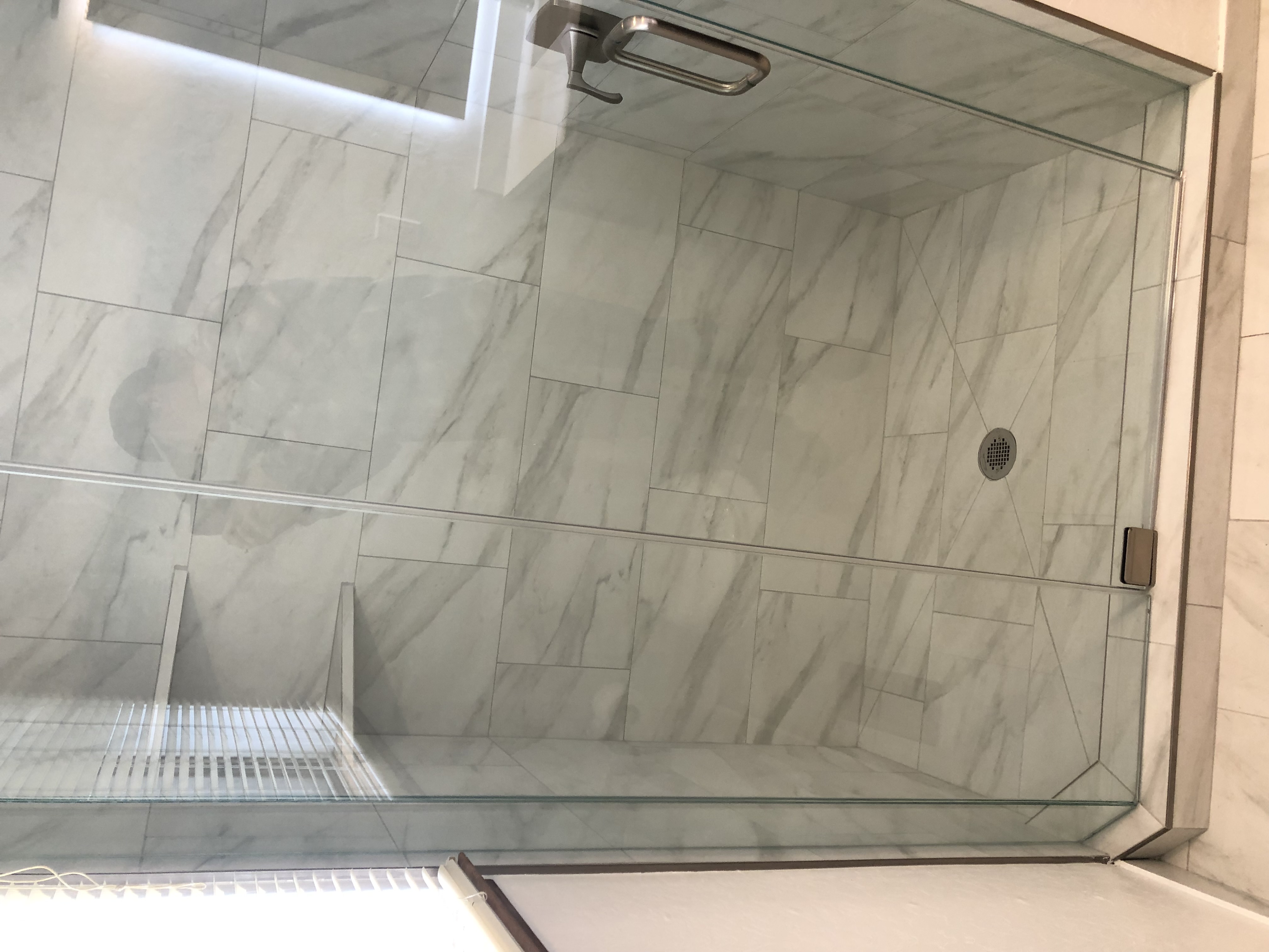 Glass enclosed marble shower
