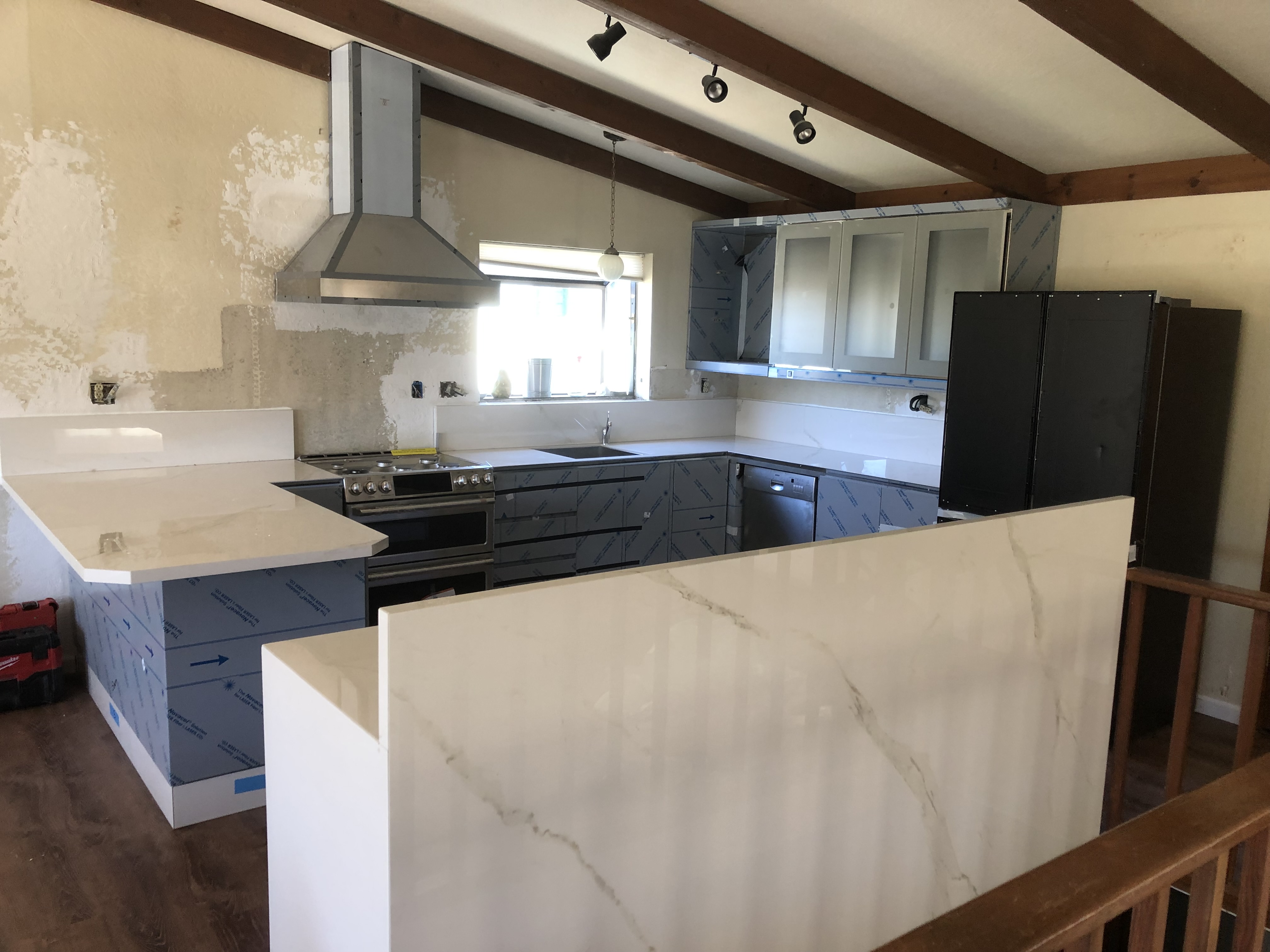 Kitchen remodel with exposed wood beams