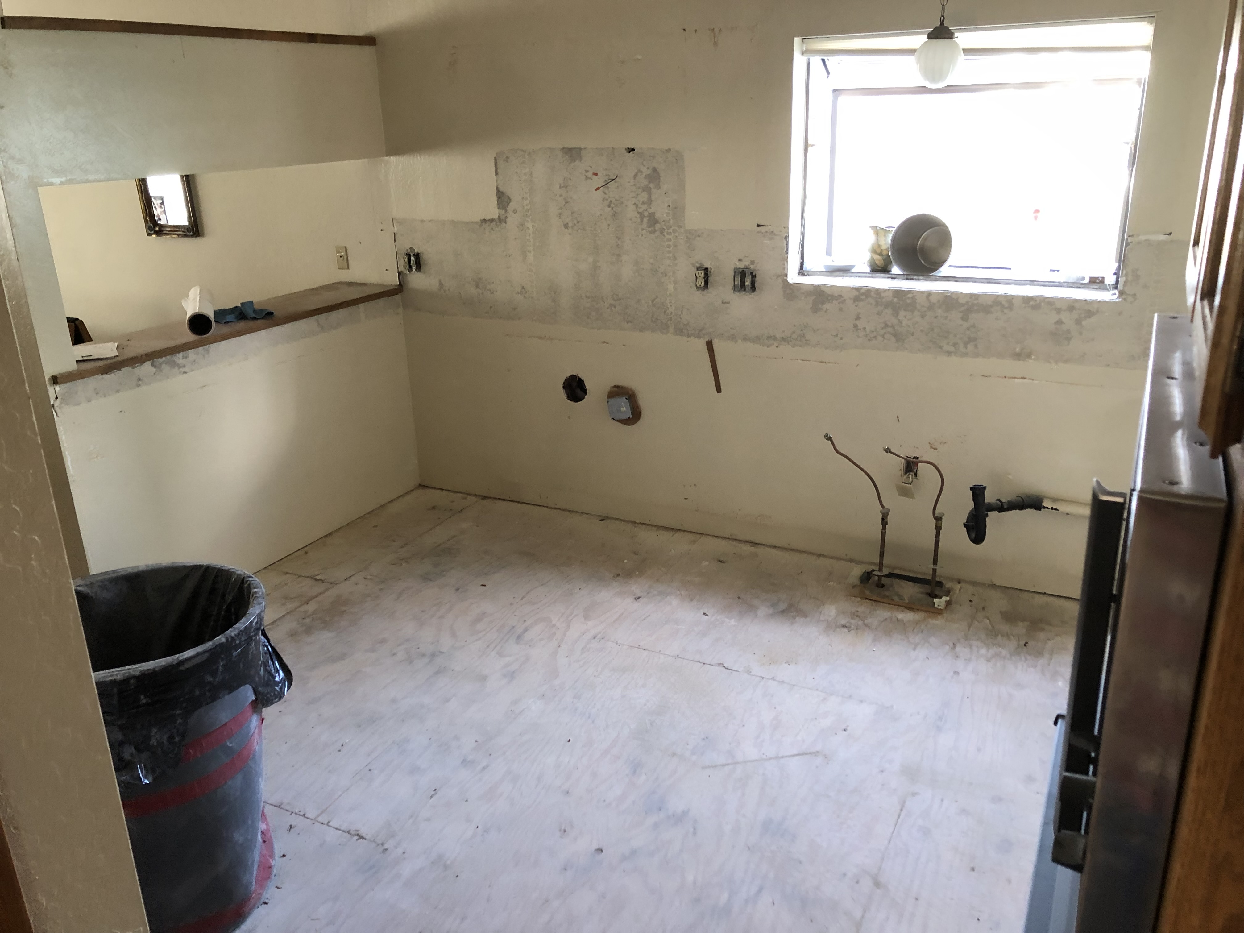 Kitchen during demolition, cabinets removed