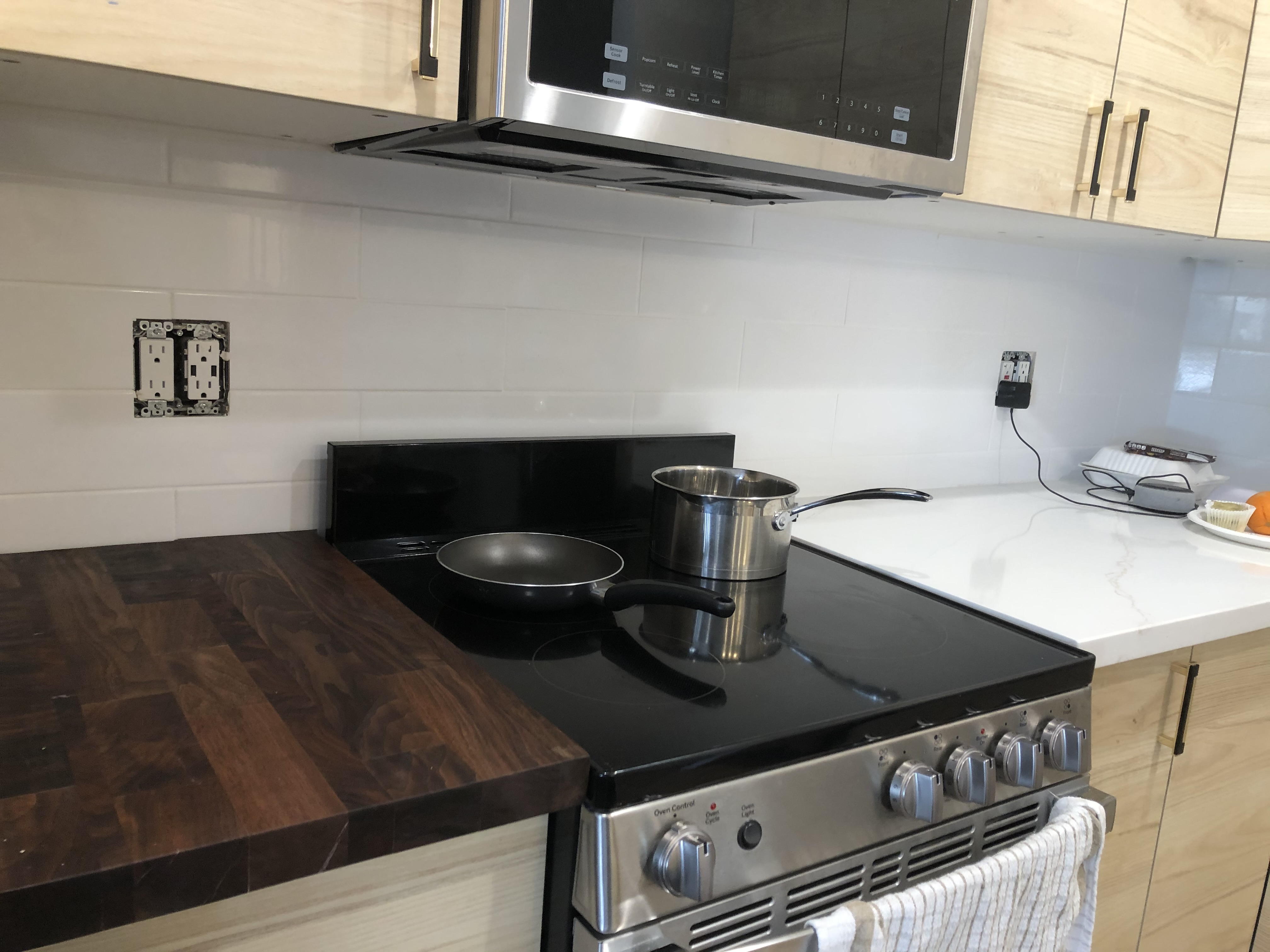 Modern kitchen with butcher block and subway tile