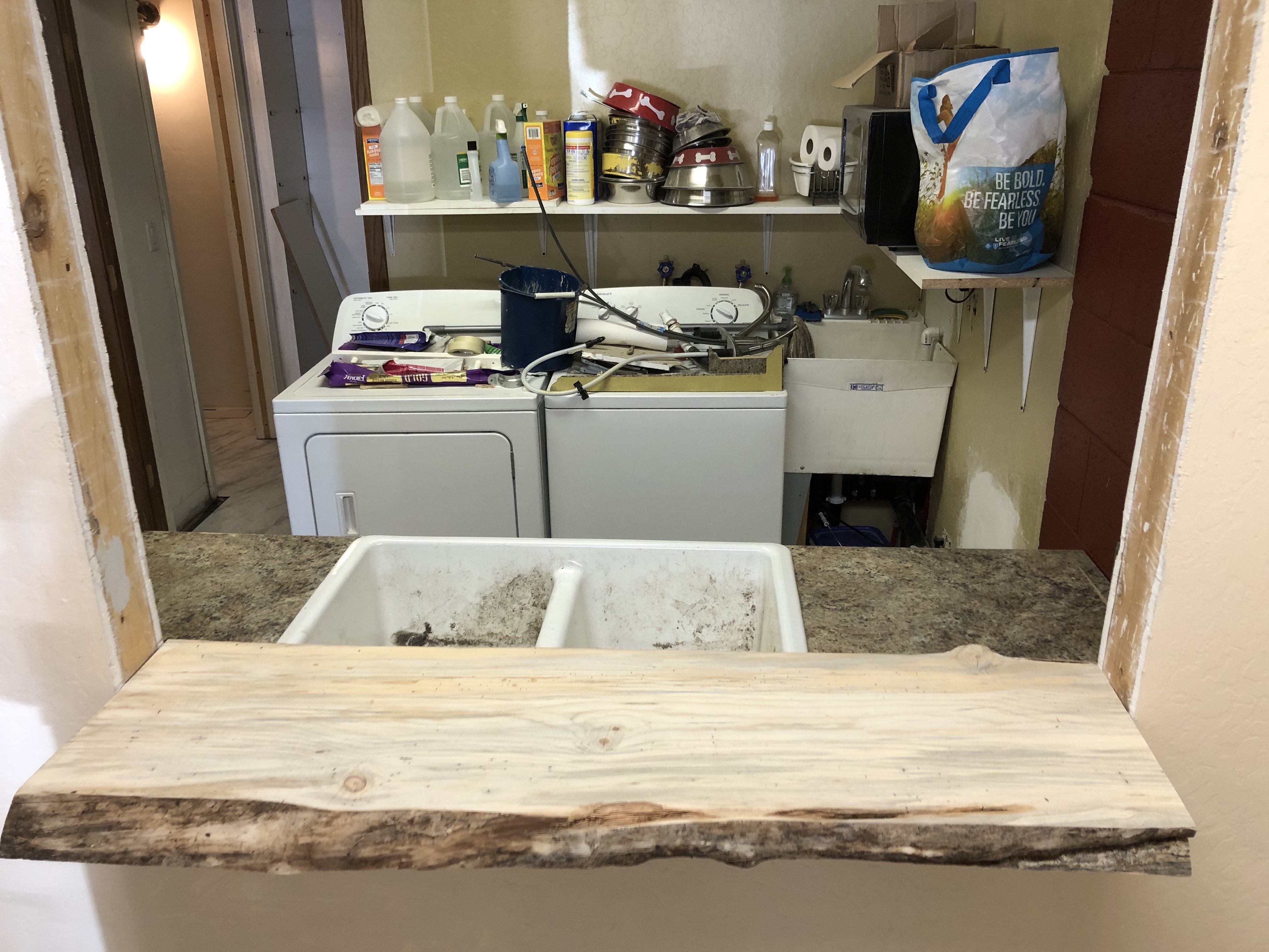 Laundry room pass-through with live edge counter