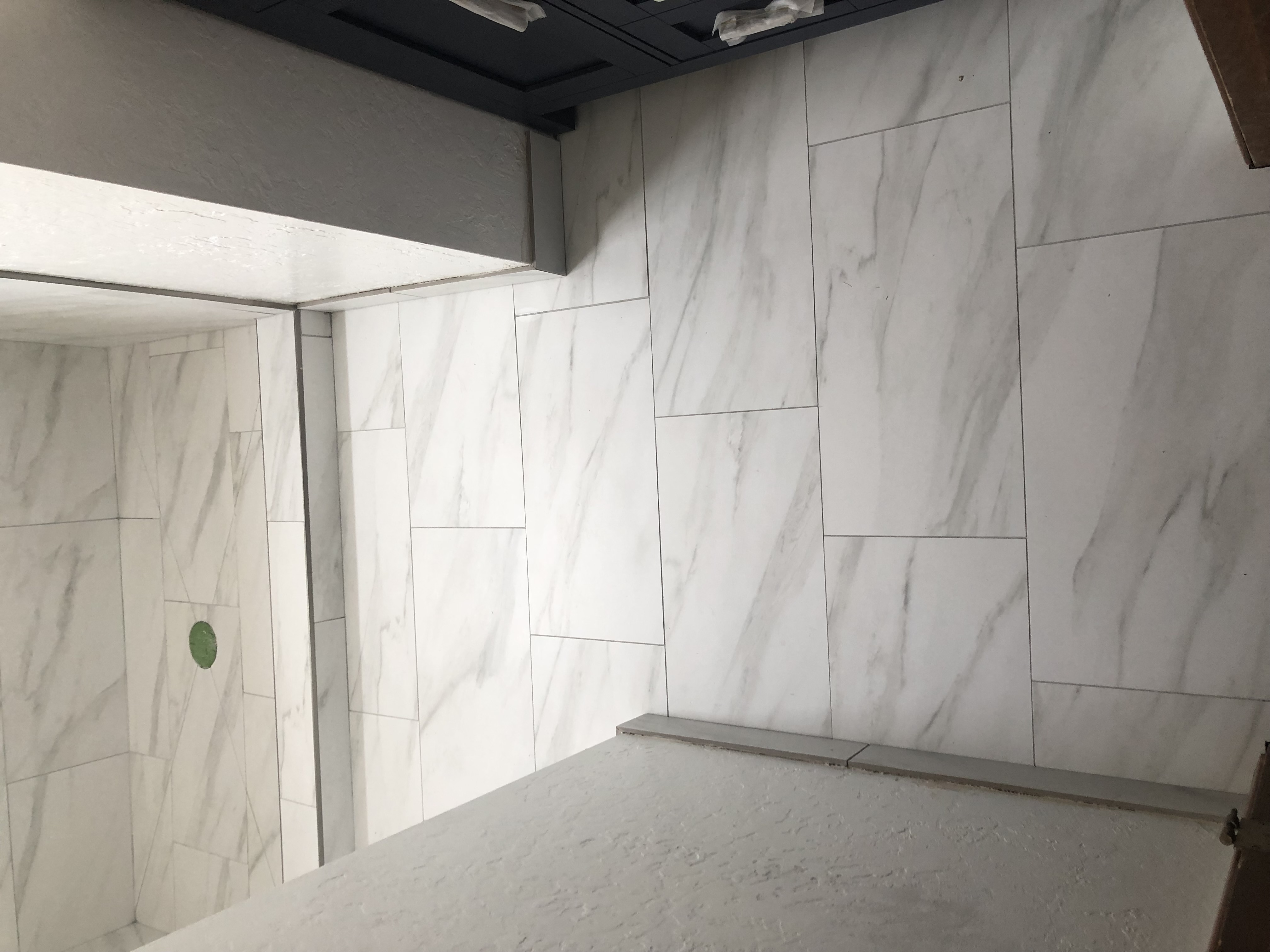 Large marble tile walk-in shower