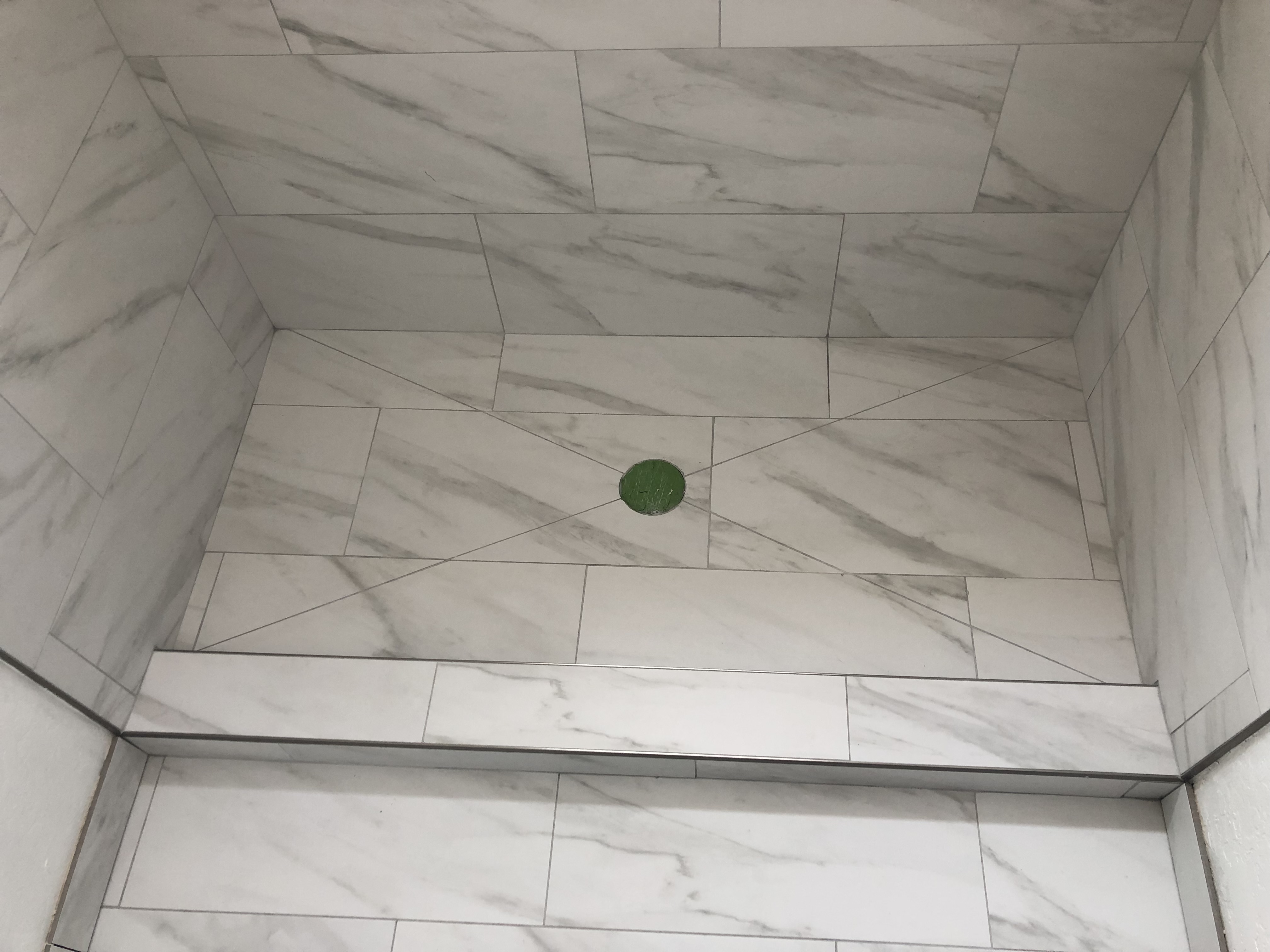 Marble shower floor with center drain